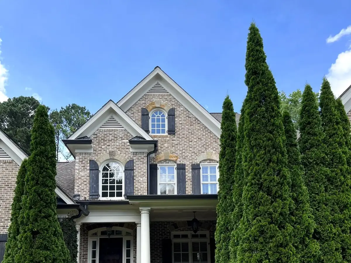 Two-story brick home with freshly cleaned windows