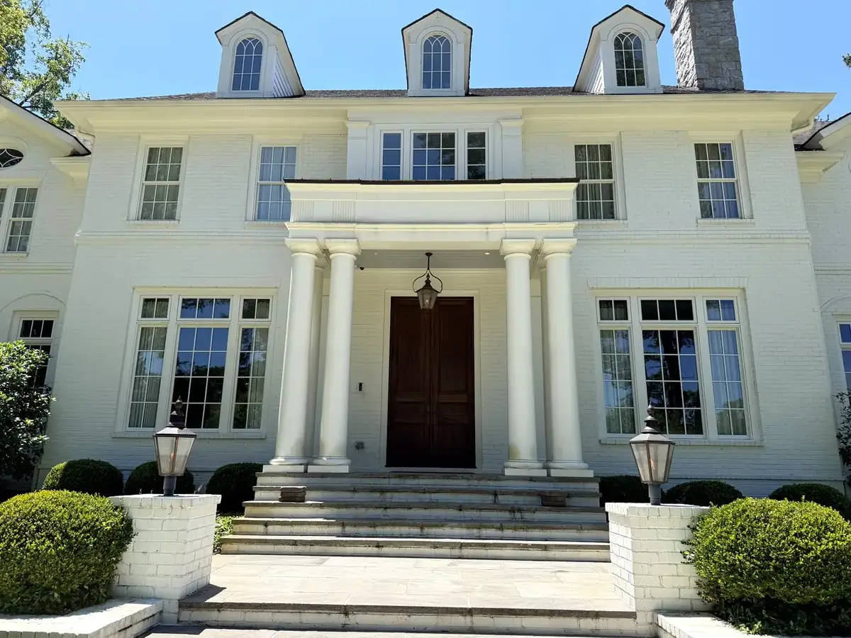 White colonial home with clean windows